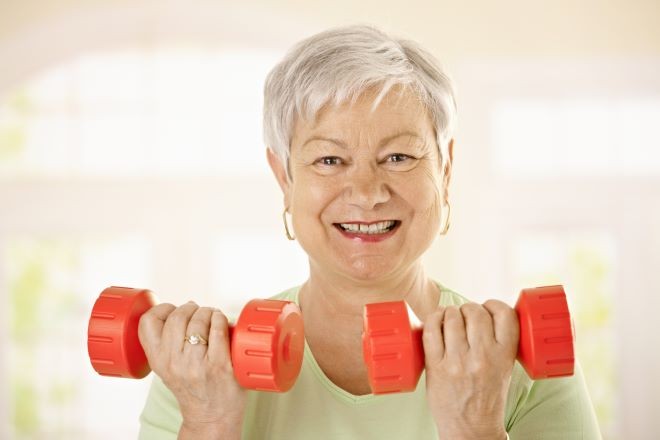 Woman holding weights Woman holding weights